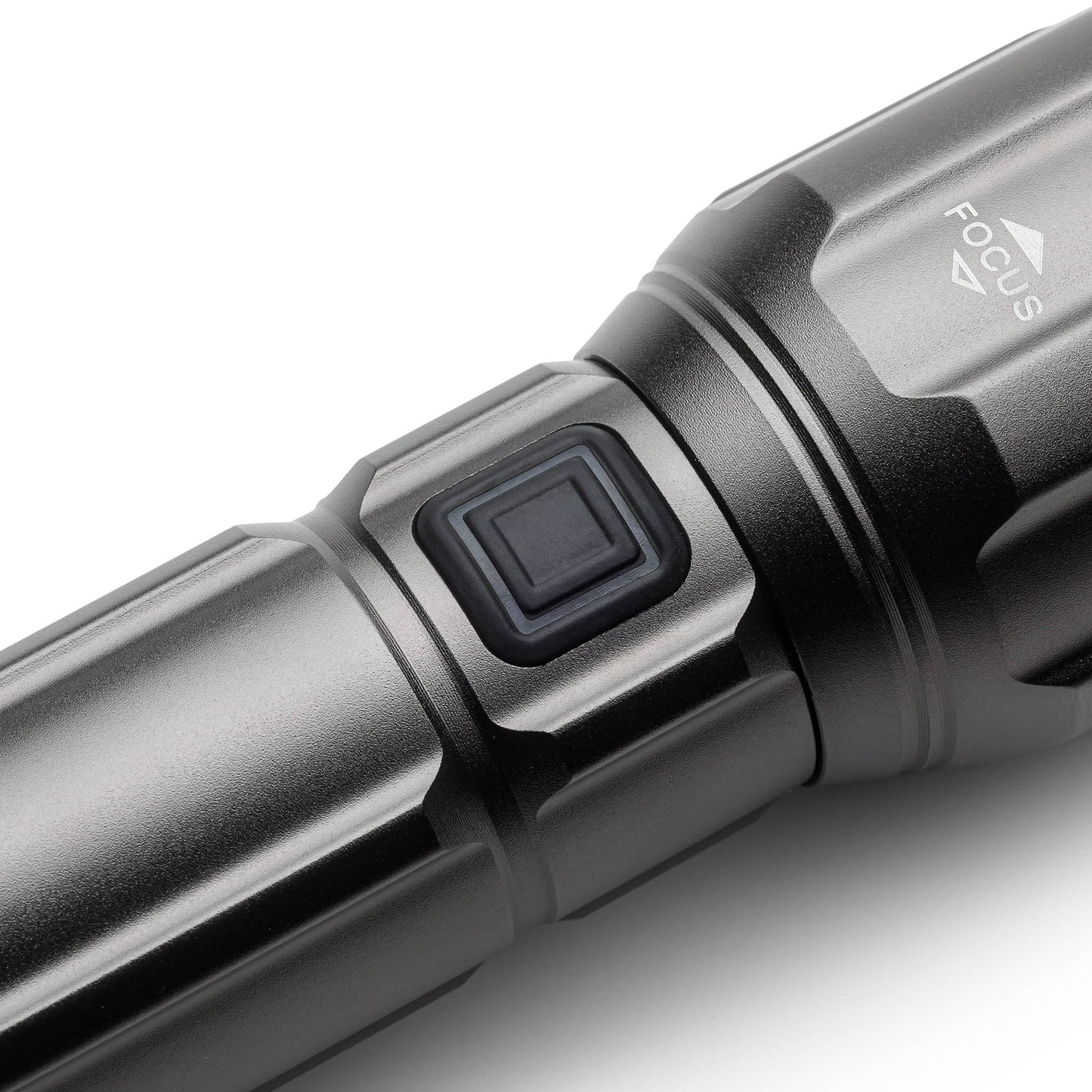 Power button on the side of handheld flashlight