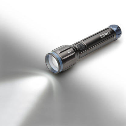 Dark gray CORE 1200 lumen flashlights with blue accents, light on. 